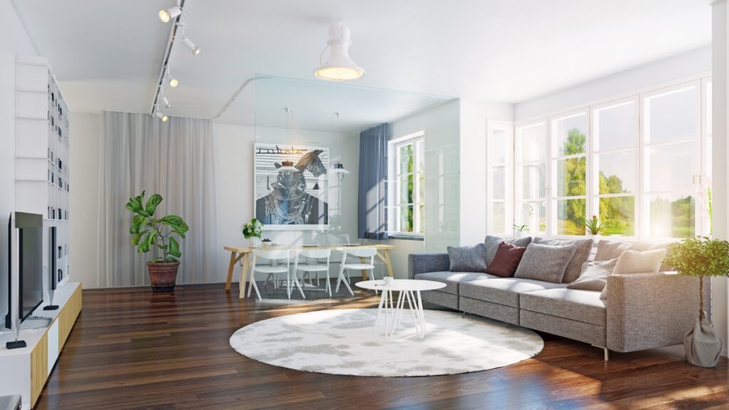 Deep-cleaned open-concept living room with polished hardwood floors and neatly arranged furniture.